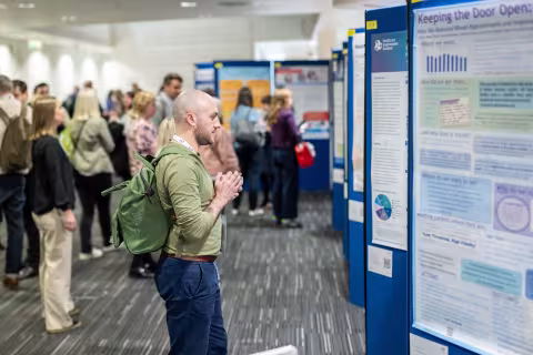Person looking at poster disaply