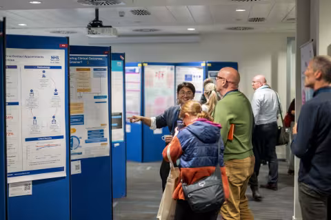 People viewing the 2026 poster displays